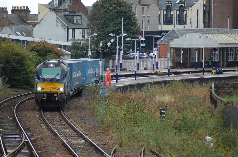 68002 4A13: 68002 Intrepid passes the Dundee S&T at AH47 as it comes off the restrictive curve through Arbroath working 4A13 Grangemouth - Aberdeen. 9/10/2014 Photo of 68002 4A13