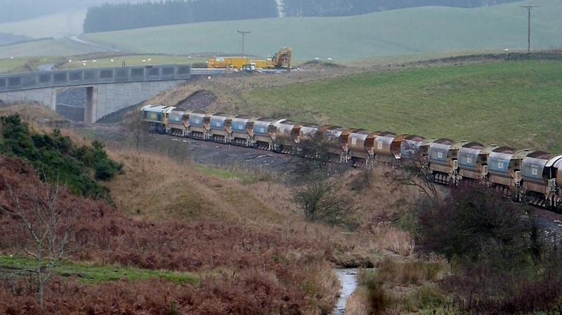 Loaded ballast southbound past Heriot.: With the rail laying train at Stow, this ballast drop would be near Fountainhall. Photo of Loaded ballast southbound past Heriot.