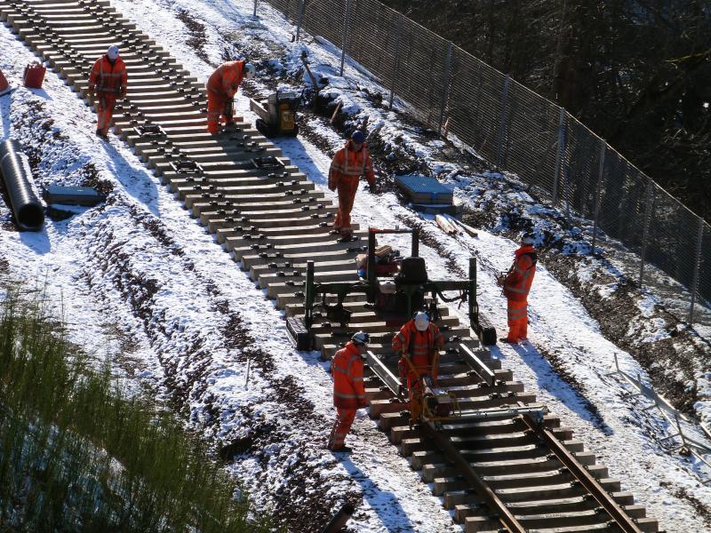 End of the line, but not for long.: Half of the load of rails laid at lunchtime on the 30th of January. Gala just round the corner!
Photo of End of the line, but not for long.