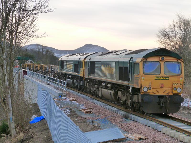 Freightliner 66`s & The Eildon Hills: Two of the Eildon Hills showing above the Rail Train locos. Tweedbank lies about 2 miles this side, so not far to go now
Photo of Freightliner 66`s & The Eildon Hills