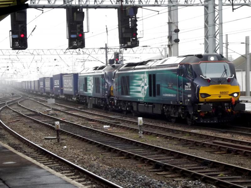 68007 and 68004 at Carlisle: Emerging from the gloom of the Misty day. DRS 68007 and 68004 arrive at Carlisle with 4S43, the Tesco Intermodal from Daventry to Mossend on Saturday 7th February 2015 Photo of 68007 and 68004 at Carlisle