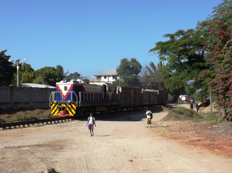 Loco Hauled Freight: A Tazara loco heads up a short consist at Kurasini, Dar es Salaam, Tanzania in early February 2015. Photo of Loco Hauled Freight