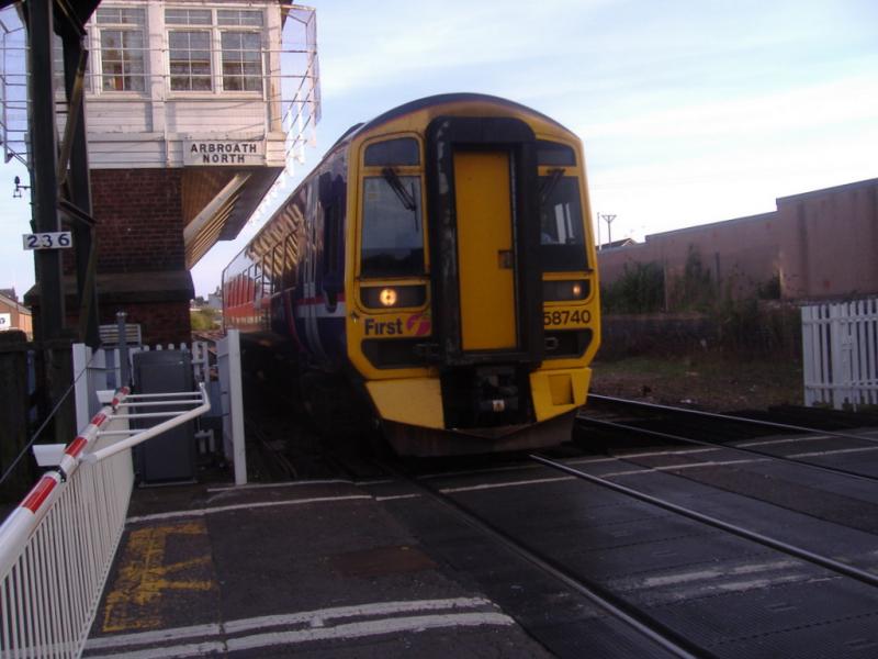 158 740: Heading for the up siding 158 740 passes Arbroath North signalbox and L/C. Photo of 158 740