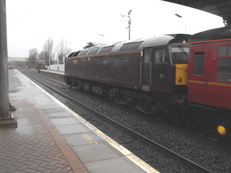 rear loco on Royal Scotsman at Grahamston: I'm afraid it's not as clear as I had hoped. Trying to shelter out the heavy rain. Showing the red coach it must have picked up from Kilmarnock. Photo of rear loco on Royal Scotsman at Grahamston