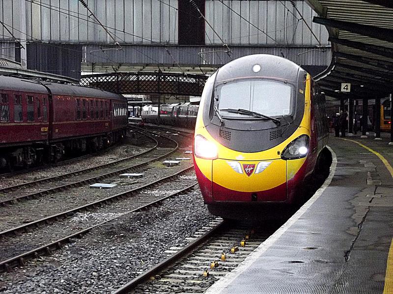 390002 at Carlisle: 9 Car Virgin Pendolino 390002 waits at Carlisle with a service from Glasgow Central to London Euston via Birmingham on Saturday 7th March 2015 Photo of 390002 at Carlisle