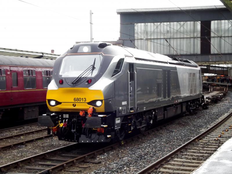 68013 at Carlisle: DRS operated, but in Chiltern colours 68013 waits at Carlisle with 4Z44. An empty intermodal wagon move from Motherwell to Crewe on Saturday 7th March 2015. Photo of 68013 at Carlisle