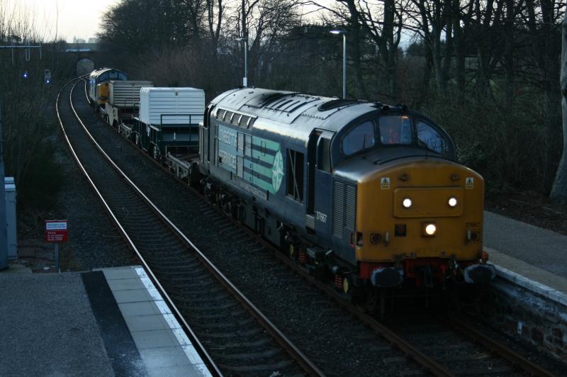 6M98 Tain: 6M98 Georgemas Junction to Carlisle Kingmoor waits to cross Inverness - Ardgay ScotRail service at Tain station on Friday 13th March 2015. 37667 and 37608 (rear) Photo of 6M98 Tain