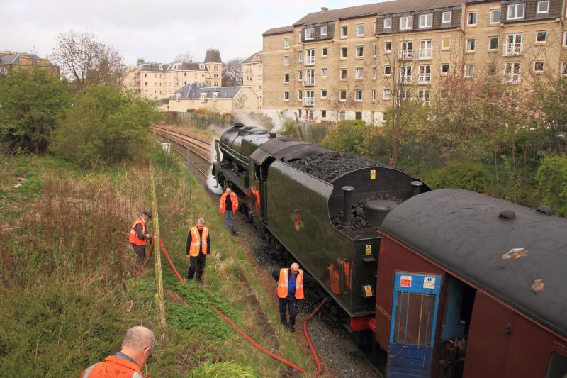 Orange jackets at Morningside: Staff watching 46115 being watered on 22/04/2012 Photo of Orange jackets at Morningside