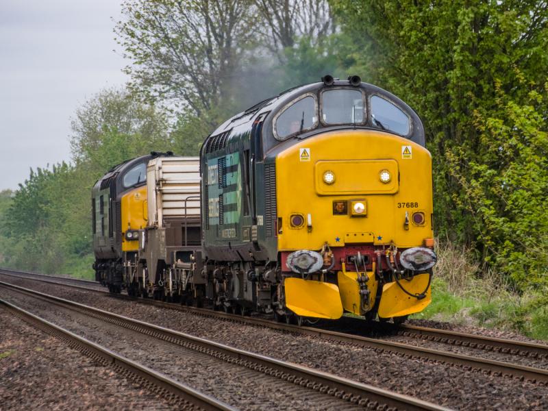 37688/37611: 37688 heads todays 6S99 past Forgandenny. 37611 is on the rear. Photo of 37688/37611