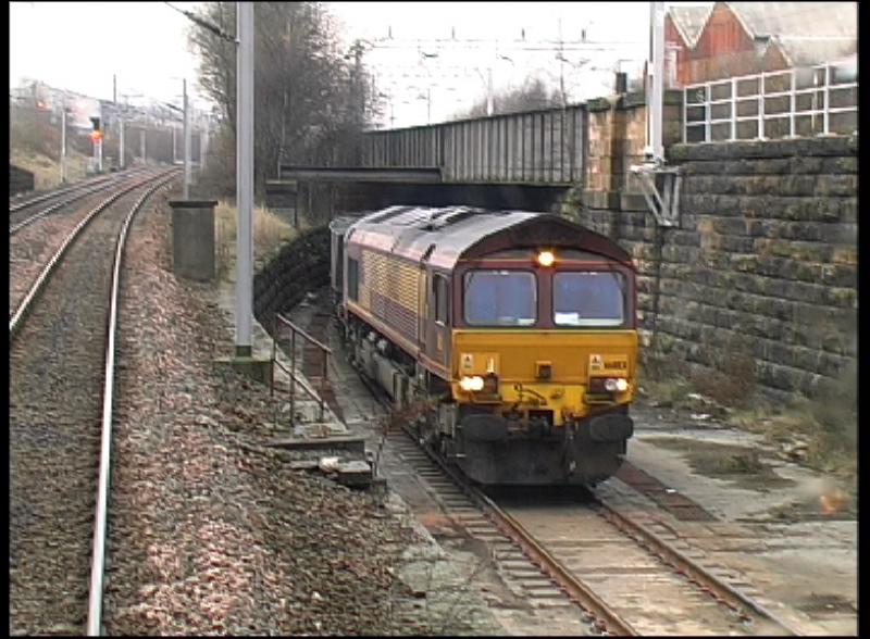 Burma Road: A class 66 on the Burma road . Photo still from Video. Photo of Burma Road