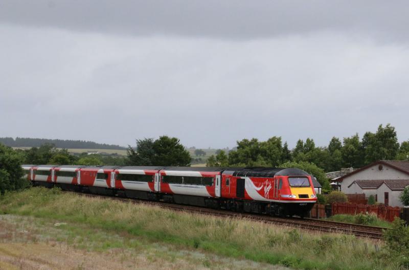 43317 leading Highland Chieftain: Passing luncarty am with a toot in full Virgin Livery Photo of 43317 leading Highland Chieftain