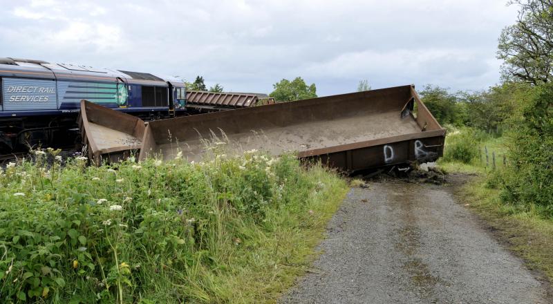66428's Wagons in the Dirt & Wagon Onto the Road: 66428 on 5th Aug 15 is picture of the (rail) road but has pushed one wagon onto the road Photo of 66428's Wagons in the Dirt & Wagon Onto the Road