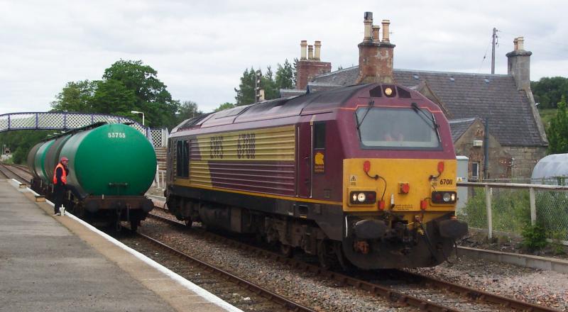 67011 running round at Lairg: 4th July 2005 - during the period the 67 off the Inverness Beds took the weekly Oil Tanks up. Photo of 67011 running round at Lairg