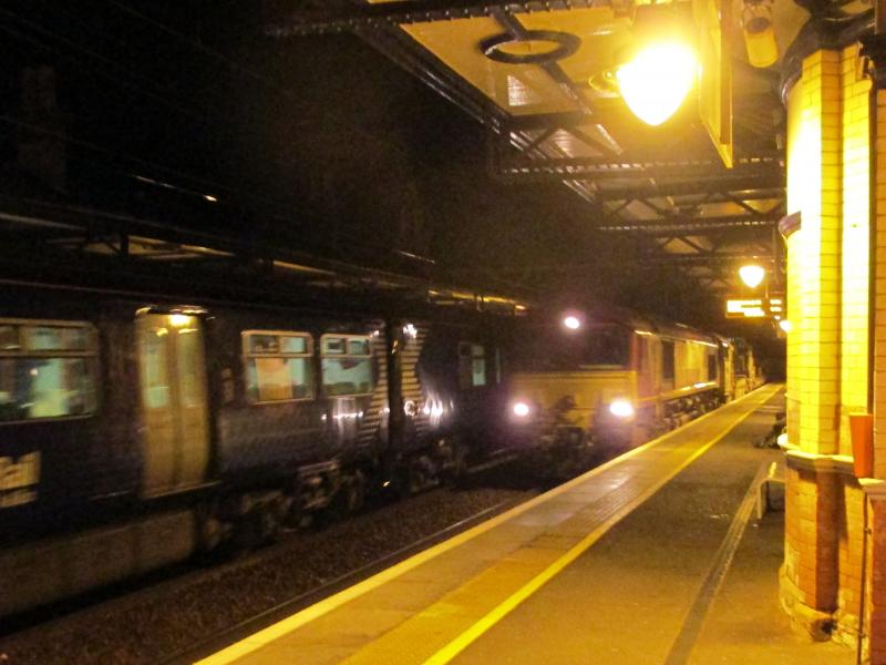 6K20 Dumbarton Central 19 Sept 2015: EWS liveried Class 66#66107 heads 6K20 towards Ardlui through Dumbarton Central running about 15 late Photo of 6K20 Dumbarton Central 19 Sept 2015