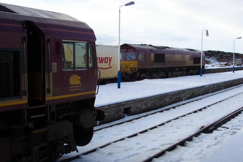 Two Freight Trains at Georgemas Junction - again !: 30th January 2004 - 66100 (nearest) on pipe train and 66099 on Photo of Two Freight Trains at Georgemas Junction - again !