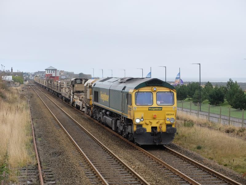 Returning engineer at Carnoustie: 692X from Elgin to Mossend passes Carnoustie headed by 66544 with 66563 at tail on a miserable 2nd November 2015. Photo of Returning engineer at Carnoustie