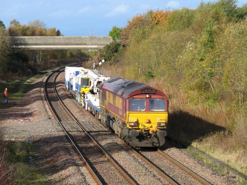 66 023 at Plean Jct: 66023 passes Plean Jct with 6K12, the 23:30 Raith's Farm - Kingmoor, moving DRK81611, Balfour Beatty's Kirow crane. Photo of 66 023 at Plean Jct