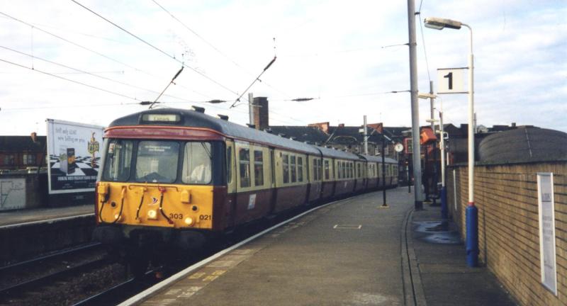 Yet another colour.....: Wearing its 5th livery since 1960, 303021 at Partick heading for Lanark in November 1997. Photo of Yet another colour.....
