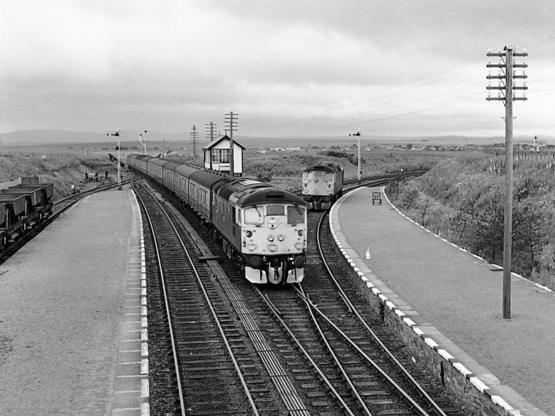 26046: While 26031 waits for the Thurso portion, 26046 brings the 06.15 ex Inverness into Georgemas Junction on 30 June 1980. Photo of 26046