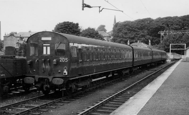 Class 302 unit at Milngavie: A few EMUs intended for the London, Tilbury & Southend line were used for test purposes on the Glasgow North Electric lines in 1959. The picture, by unknown photographer, shows unit 205 at Milngavie. Photo of Class 302 unit at Milngavie