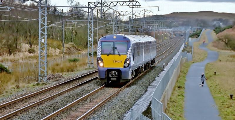 334013 at Hillend Loch.: 334013 passing Hillend Loch bound for Edinburgh with a service from Helensburgh. Photo of 334013 at Hillend Loch.