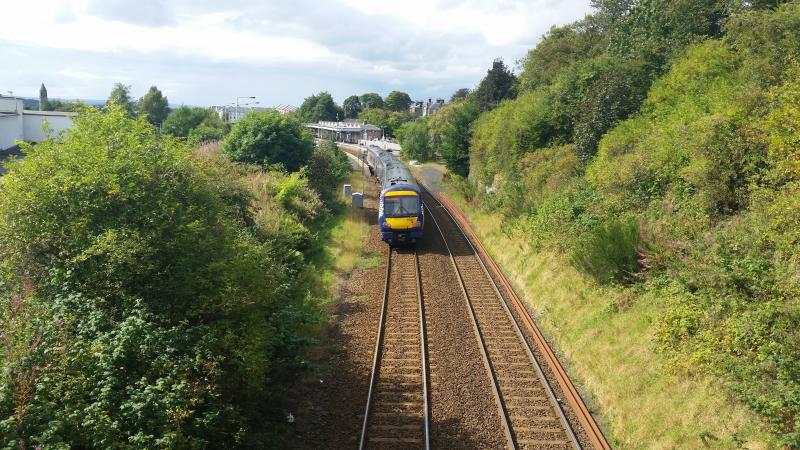 170477: 170477 approaches a sunny Dunfermline Town with an Edinburgh Waverley service 28th August 2014. Photo of 170477