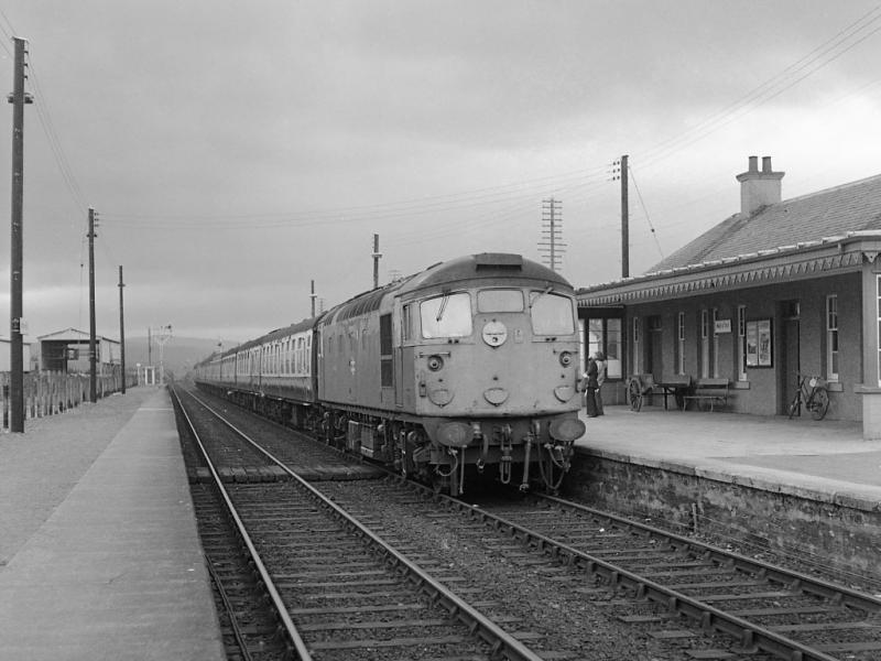 26011: Muir of Ord on 4 July 1978 and 26011 enters the station with the 17.15 from Inverness to Wick & Thurso. Photo of 26011