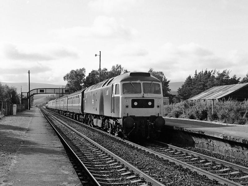 47268: 47268 enters Carrbridge on the evening of 29 June 1980 with the 17.30 from Inverness. Photo of 47268