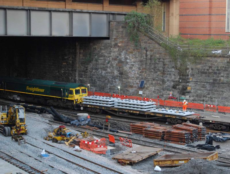 Concrete Sleeper Slab Panel Train at QS: The slabs of concrete sleeper sections waiting to be unloaded and taken to be Positioned Photo of Concrete Sleeper Slab Panel Train at QS