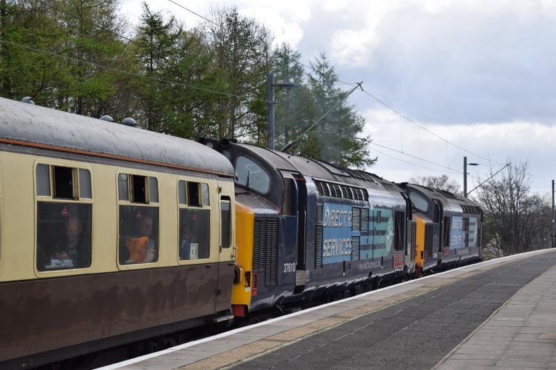 DRS Class 37s 37409 & 37610 Dumbarton East 25 April 2016: DRS Class 37s 37409 and 37610 accelerate through Dumbarton East on 25 April 2016 with the Spring West Highlander bound for Carlisle Photo of DRS Class 37s 37409 & 37610 Dumbarton East 25 April 2016