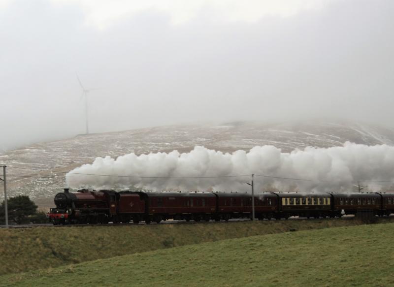 Snow in summer: 45699 at speed after a heavy sleet shower near Crawford . Photo of Snow in summer