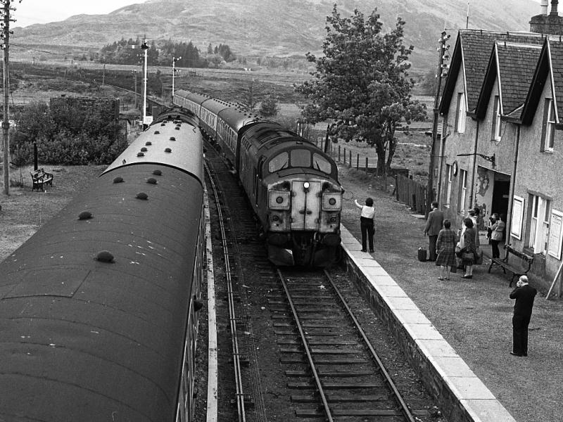 37017: While 37183 awaits departure, a very scruffy 37017 enters Achnasheen on 21 May 1984 with the 07.10 Kyle of Lochalsh - Inverness. Photo of 37017