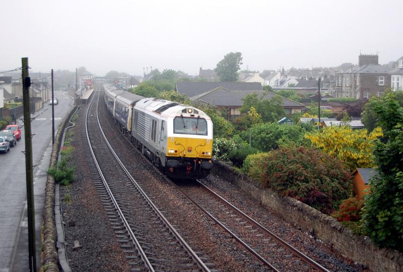 67012 Carnoustie: Running nearly 3 hours later than scheduled due to problems at Lamington, 67012 takes the Aberdeen & Fort William sleeper portions north through Carnoustie in miserable conditions. 15/6/2016 Photo of 67012 Carnoustie