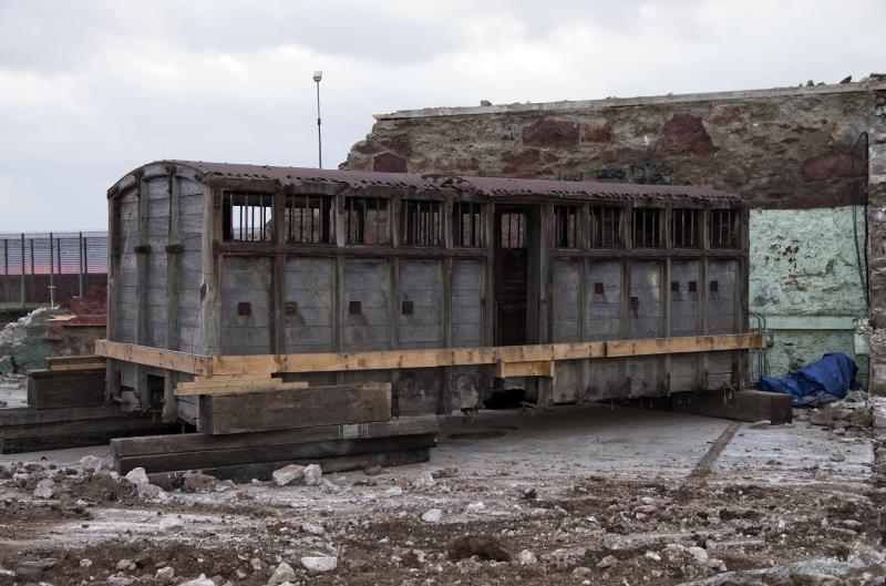 CONVICTS WAGON 8.2.12.JPG: taken immediately prior to the wagon being removed from the site of the new prison at Peterhead. It was taken to Maud stn. for safekeeping prior to restoration in the N.E. of England. Photo of CONVICTS WAGON 8.2.12.JPG
