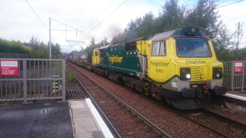 70003 passing Coatbridge Central: 70003 passing Coatbridge Central with the 4M74 Coatbridge to Basford Hall freightliner (04.09.16). Photo of 70003 passing Coatbridge Central