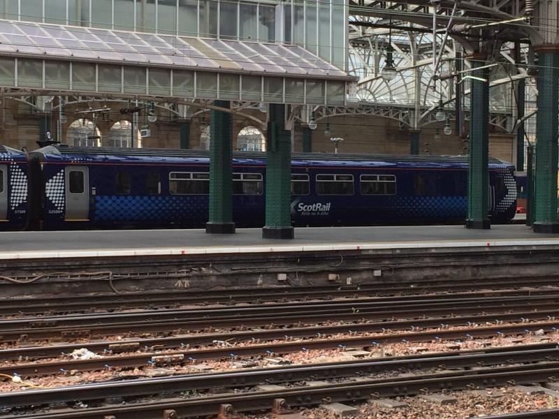 156509 at Glasgow Central: DMSL vehicle of 156509 (52509) clearly shows the revised window arrangements following the installation of the disabled toilet. The smaller windows rims have also been painted blue. Photo of 156509 at Glasgow Central