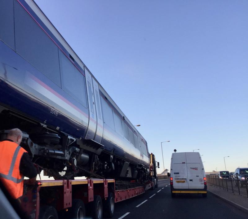 170416 low-loader Inverness: 170416 heads out of Inverness on the back of a low-loader as it negotiates the railway overbridge at the Rose Street curve Photo of 170416 low-loader Inverness