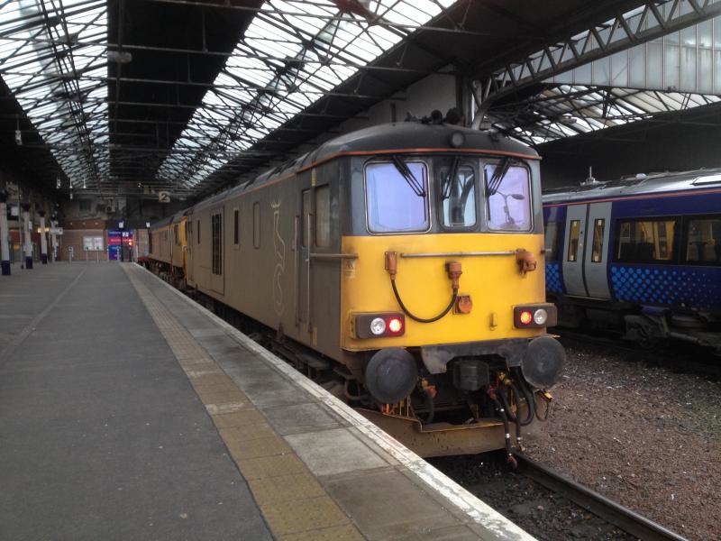 IMG_2472.JPG:
Inverness sleeper traction in platform 2 on Sat 15th. 66719 and 73968 both look as
if they had a hard Friday night ! Screaming for a de-lousing, probably frightened
of putting water near 73968 for fear of damage !
Photo of IMG_2472.JPG