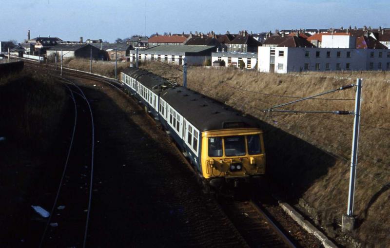 Lanark: A 303 leaves Lanark in the early 1980s, prior to the closure of the goods yard. Photo of Lanark