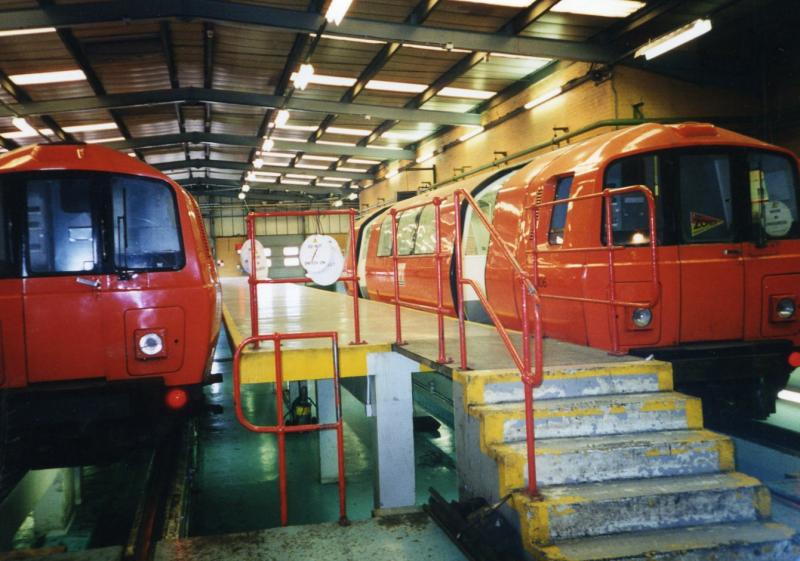 Under repair: Cars 106 and 137 over the inspection pits at Broomloan Road on the occasion of an Open Day in June 1997. Photo of Under repair