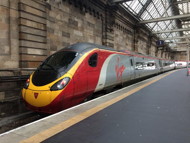 Photo of VT 390115 departs Glasgow Central