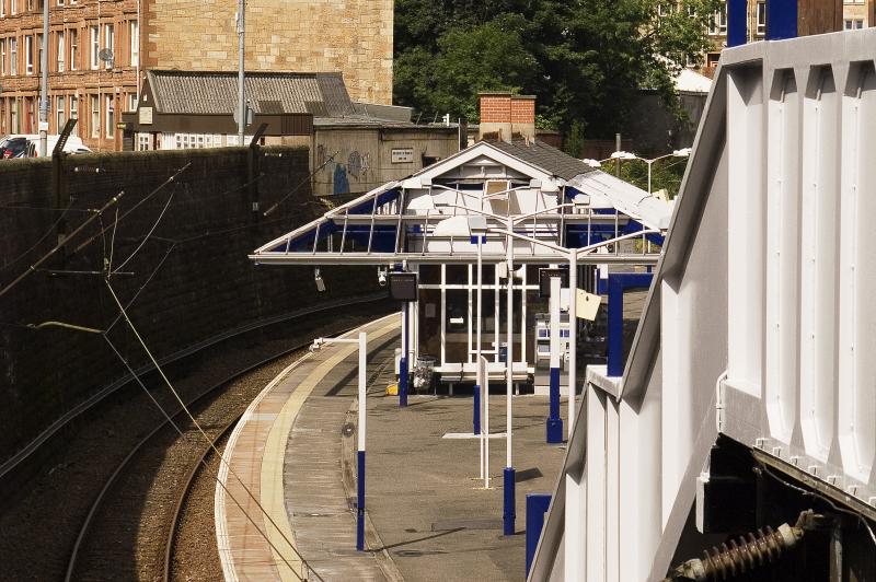 Queens Park Station1: Station during refurb works showing new blue and grey colour scheme.New glass still to be fitted to roof Photo of Queens Park Station1