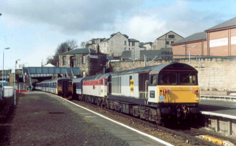 Not many of these..........: ...go through Springburn in a day. Class 58 58011 and Derby Research's 47972 ROYAL ARMY ORDNANCE CORPS heading the Worksop Wanderer railtour in March 1994. Photo of Not many of these..........