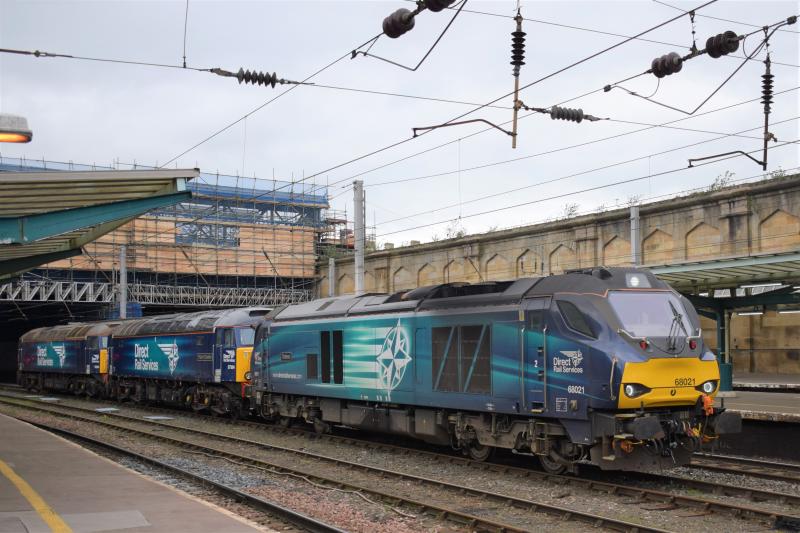 DRS Class 68/57s Carlisle: Drs Class 68 68021 Tireless hauling DRS Class 57s 57304 and 57003 awaits a southbound path on the WCML at Carlisle on 20 April 2017 Photo of DRS Class 68/57s Carlisle