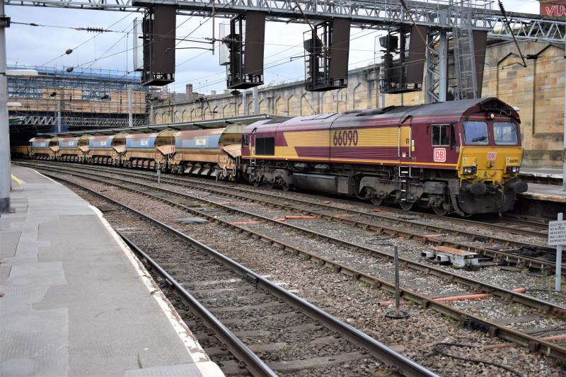 DBC Class 66 Carlisle 20.4.17: DBC Class 66 #66090 heads through Platform 4 at Carlisle with the Carlisle N.Y. to Tyne S.S. consisting of autoballasters and MLAs. Photo of DBC Class 66 Carlisle 20.4.17