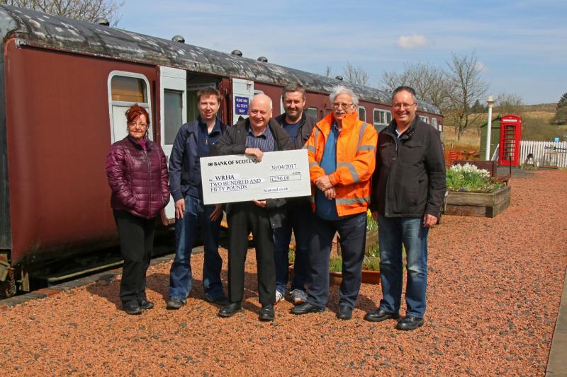 WRHA presentation: Members of the scot-rail.co.uk Admin team accompanied by other members present a cheque for £250 to the Waverley Route Heritage Association at their Whiterope base. 30th April 2017 Photo of WRHA presentation