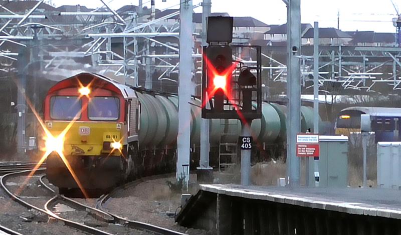66101 w/WHL Tanks @ Springburn (03/01/17): DBS Red 66101 on 6Y15, the 08:23 Mossend to Fort William Yard Oil TTA tankers a few months prior to the end of this working in April 2017. Photo of 66101 w/WHL Tanks @ Springburn (03/01/17)