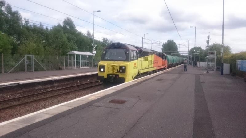 70802 at Coatbridge Central: 70802 passing through Coatbridge Central with the 6N47 Prestwick - Grangemouth empty tanks (23.05.17). Photo of 70802 at Coatbridge Central