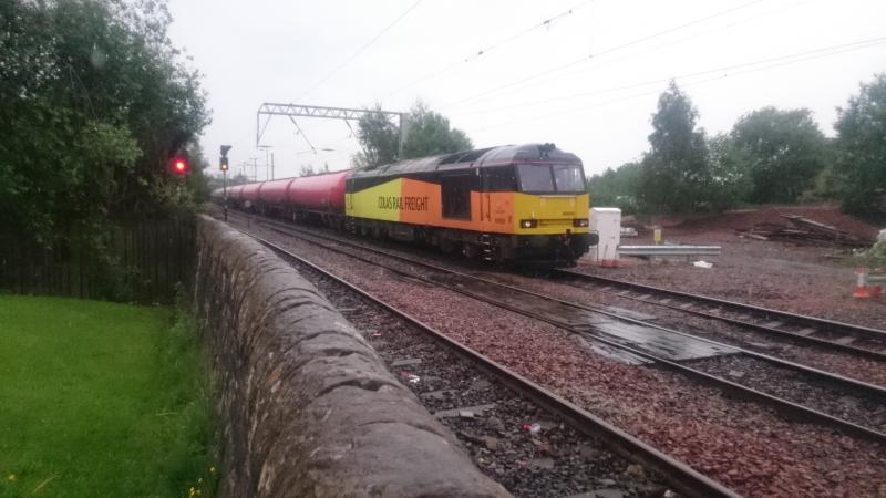 60026 passing Coatbridge: 60026 passing Coatbridge with a rake of tanks for Grangemouth (30.05.17). Photo of 60026 passing Coatbridge