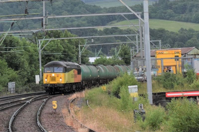 Colas 56 Fort William tanks: Colas 56 #56302 approaches Dumbarton Central on Sunday 2 July 2017 with the Grangemouth-Fort William tanks Photo of Colas 56 Fort William tanks